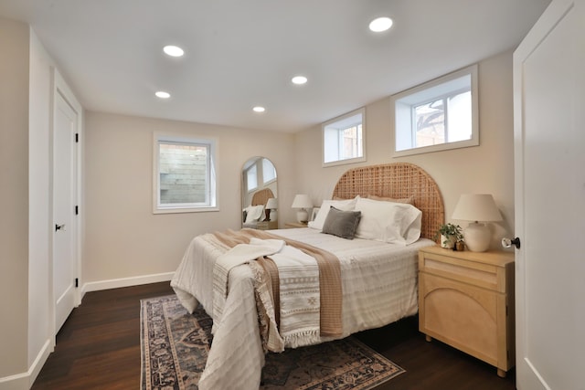 bedroom with recessed lighting, dark wood-style flooring, and baseboards