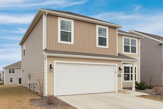 view of front of home with driveway and an attached garage