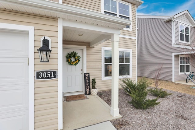 doorway to property featuring a garage