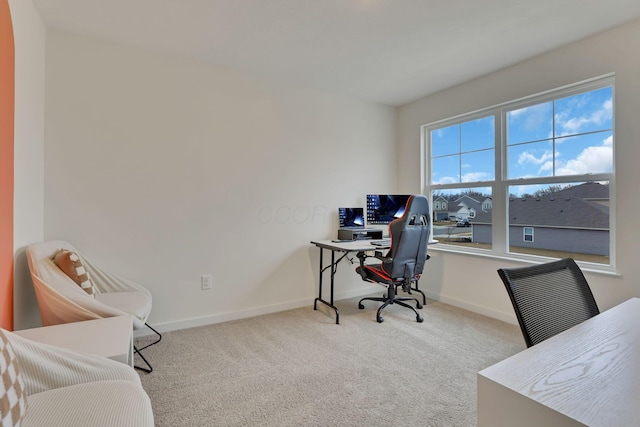 office featuring baseboards and carpet flooring