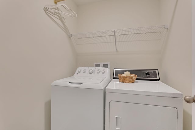 washroom featuring laundry area and washer and dryer