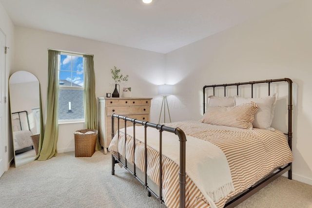 carpeted bedroom with baseboards