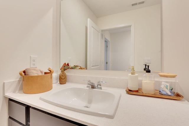 bathroom featuring visible vents and vanity