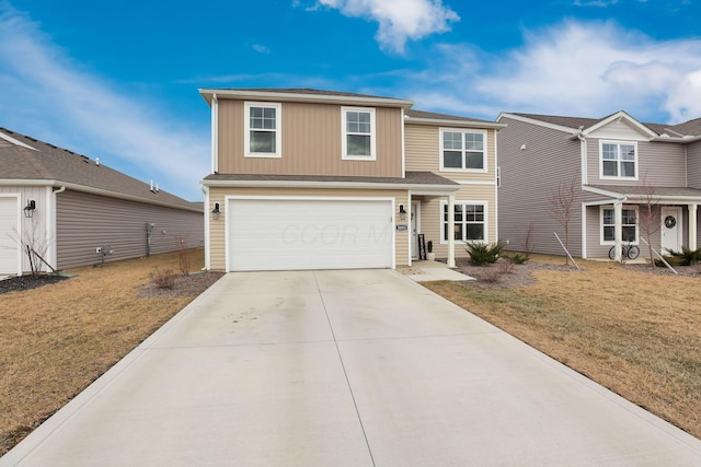 traditional-style home with concrete driveway, an attached garage, and a front yard