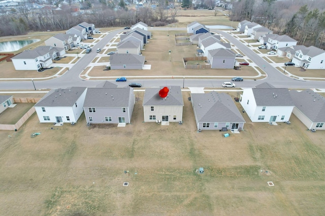 birds eye view of property with a residential view