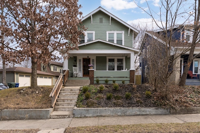 view of front of home with covered porch and stairs