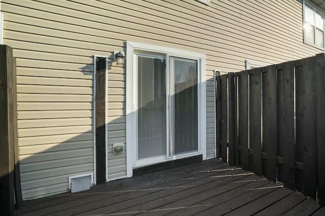 wooden deck featuring fence