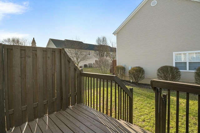 deck featuring a lawn