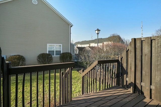 wooden deck with a yard