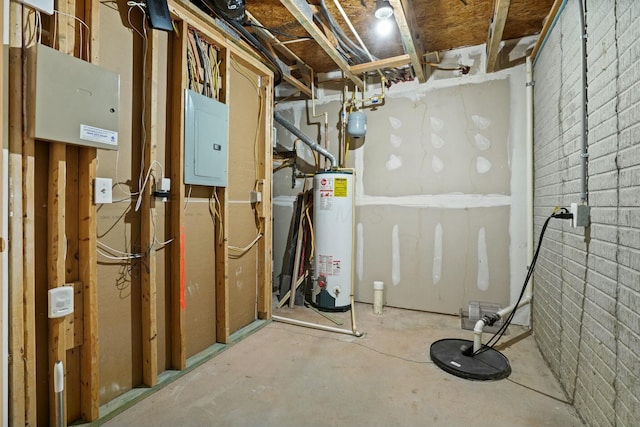 utility room featuring electric panel and water heater