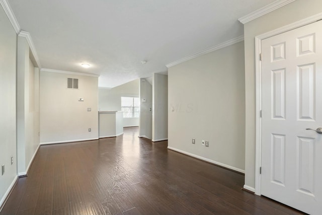 unfurnished room featuring visible vents, baseboards, dark wood-type flooring, and ornamental molding