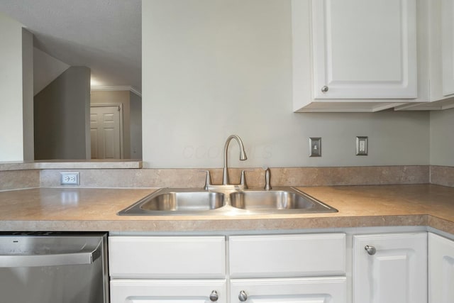 kitchen featuring a sink, dishwasher, white cabinets, and light countertops