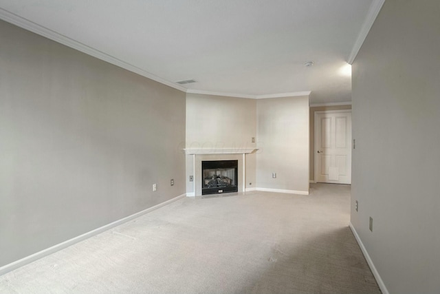 unfurnished living room with visible vents, baseboards, carpet, a fireplace with flush hearth, and ornamental molding