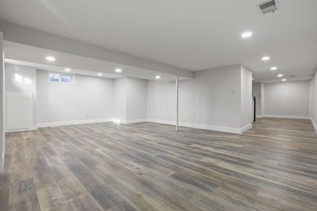 below grade area featuring visible vents, wood finished floors, and recessed lighting