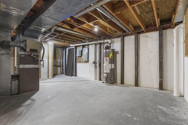 unfinished basement with gas water heater, electric panel, and heating unit