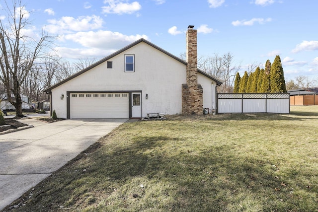 view of property exterior with a garage, fence, driveway, a lawn, and stucco siding