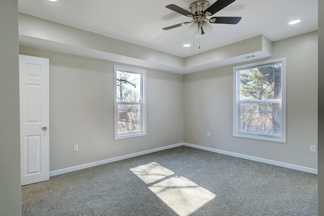 carpeted spare room featuring recessed lighting, ceiling fan, and baseboards