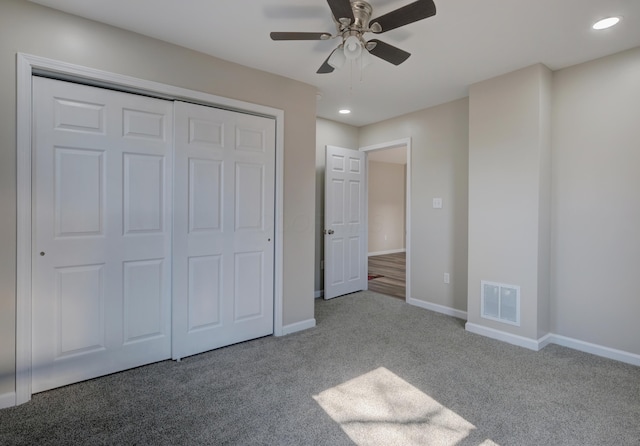 unfurnished bedroom featuring carpet floors, recessed lighting, a closet, visible vents, and baseboards