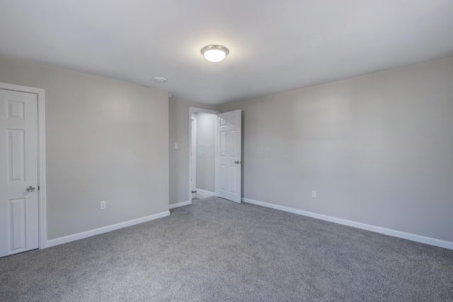 spare room with carpet floors and baseboards