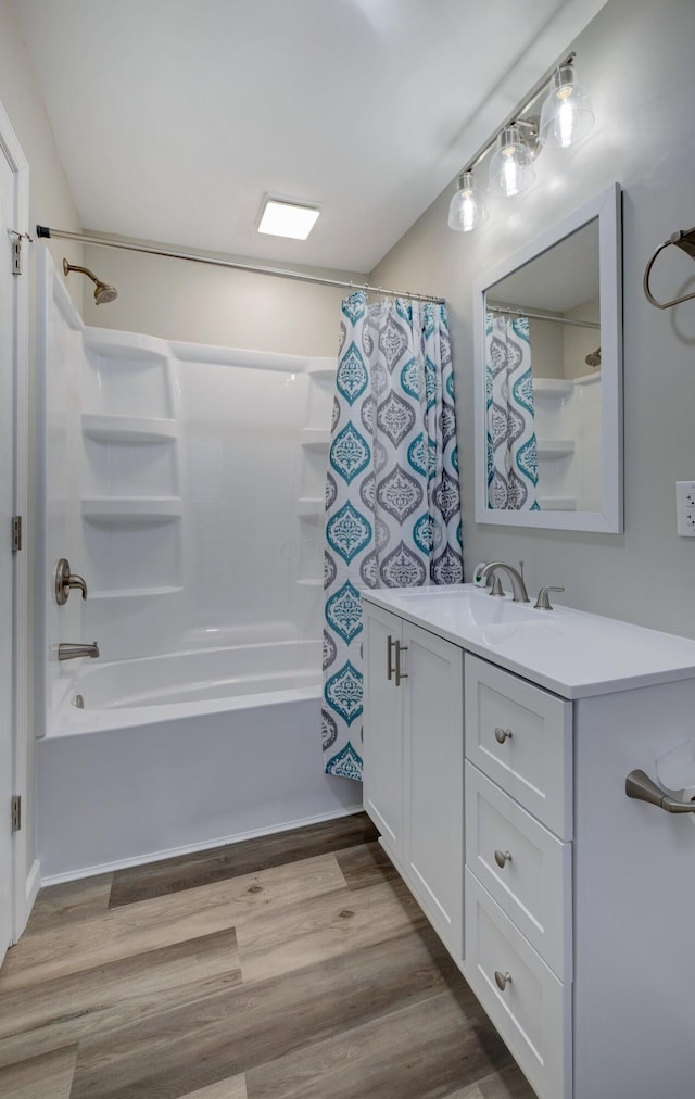 full bathroom with shower / bath combination with curtain, vanity, and wood finished floors