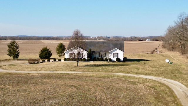 view of front of home with a rural view