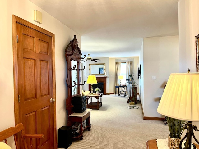 corridor with baseboards and carpet floors