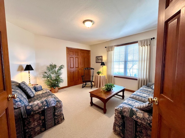 living room featuring light colored carpet and baseboards