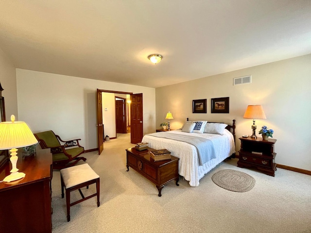 bedroom with light colored carpet, baseboards, and visible vents