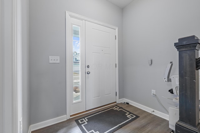 entryway featuring wood finished floors and baseboards