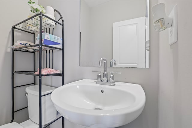 bathroom featuring toilet and a sink