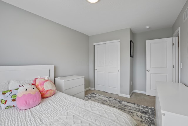 bedroom featuring carpet flooring, visible vents, and baseboards