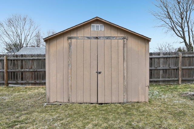 view of shed featuring fence