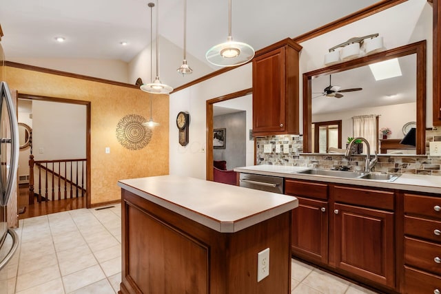 kitchen with vaulted ceiling with skylight, a sink, light countertops, a center island, and dishwasher