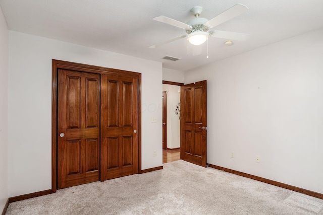 unfurnished bedroom with light carpet, ceiling fan, visible vents, and baseboards