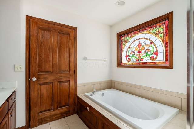 full bathroom with a garden tub, tile patterned flooring, and vanity