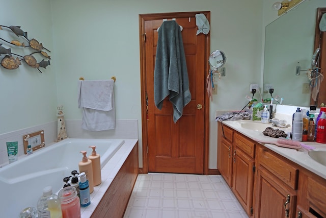 full bath with double vanity, a sink, a bath, and tile patterned floors