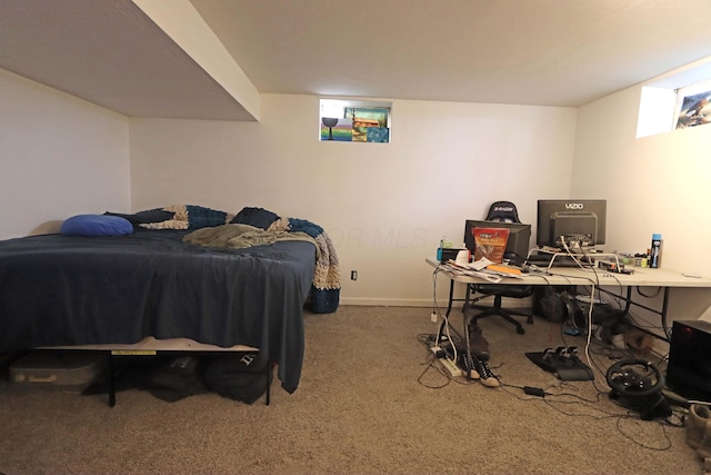 bedroom with carpet flooring and baseboards