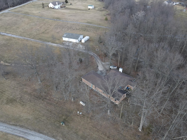 birds eye view of property with a rural view