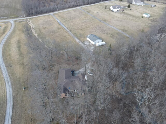 birds eye view of property featuring a rural view