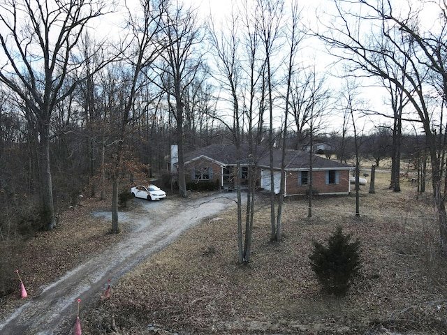 view of front of home with brick siding and driveway