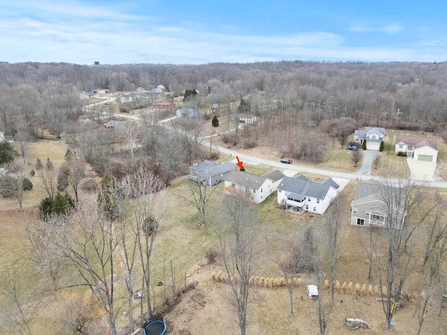 bird's eye view featuring a wooded view