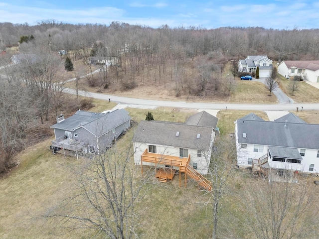 birds eye view of property with a residential view and a view of trees