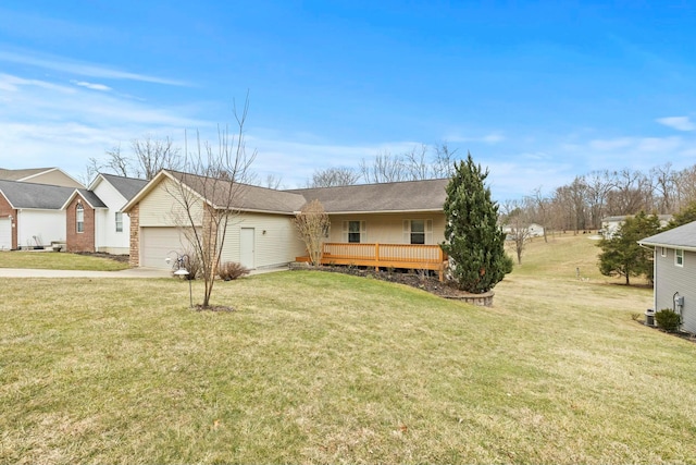 view of front facade featuring a front lawn, driveway, a deck, and an attached garage