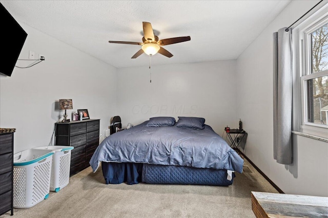 bedroom featuring carpet and a ceiling fan