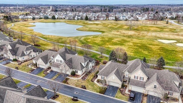 aerial view with a water view and a residential view