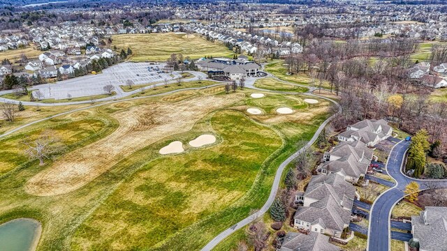 birds eye view of property featuring a residential view and view of golf course