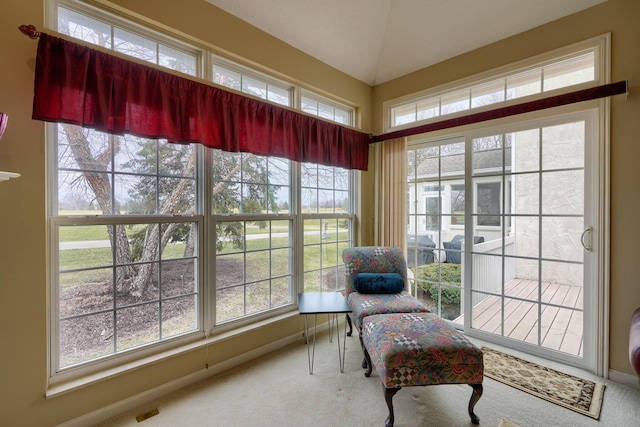 sunroom with visible vents and vaulted ceiling