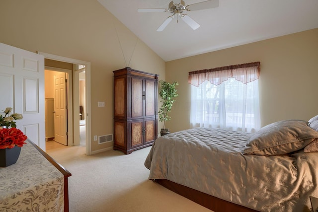 bedroom with high vaulted ceiling, a ceiling fan, visible vents, and light colored carpet