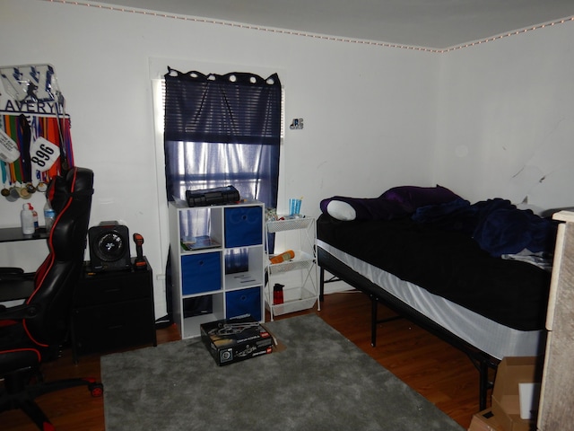 bedroom featuring wood finished floors