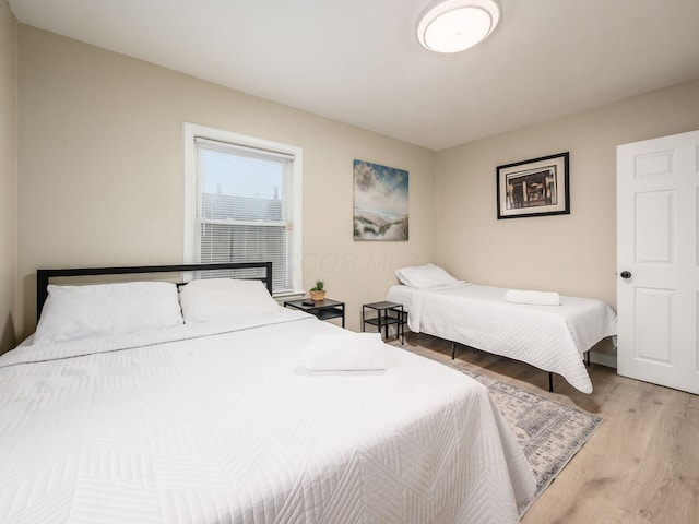 bedroom featuring wood finished floors